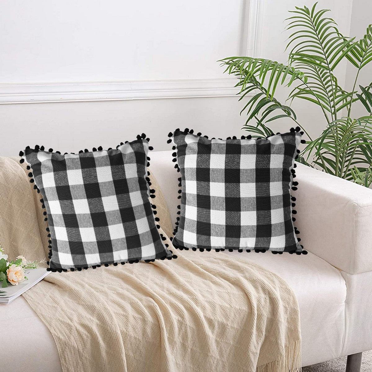 Black and white pom pom clearance pillow